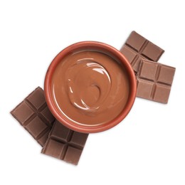 Photo of Tasty milk chocolate paste in bowl and pieces isolated on white, top view