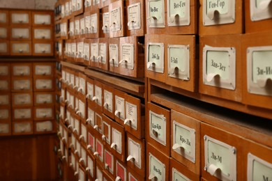 Photo of Card catalog drawers in library, closeup view