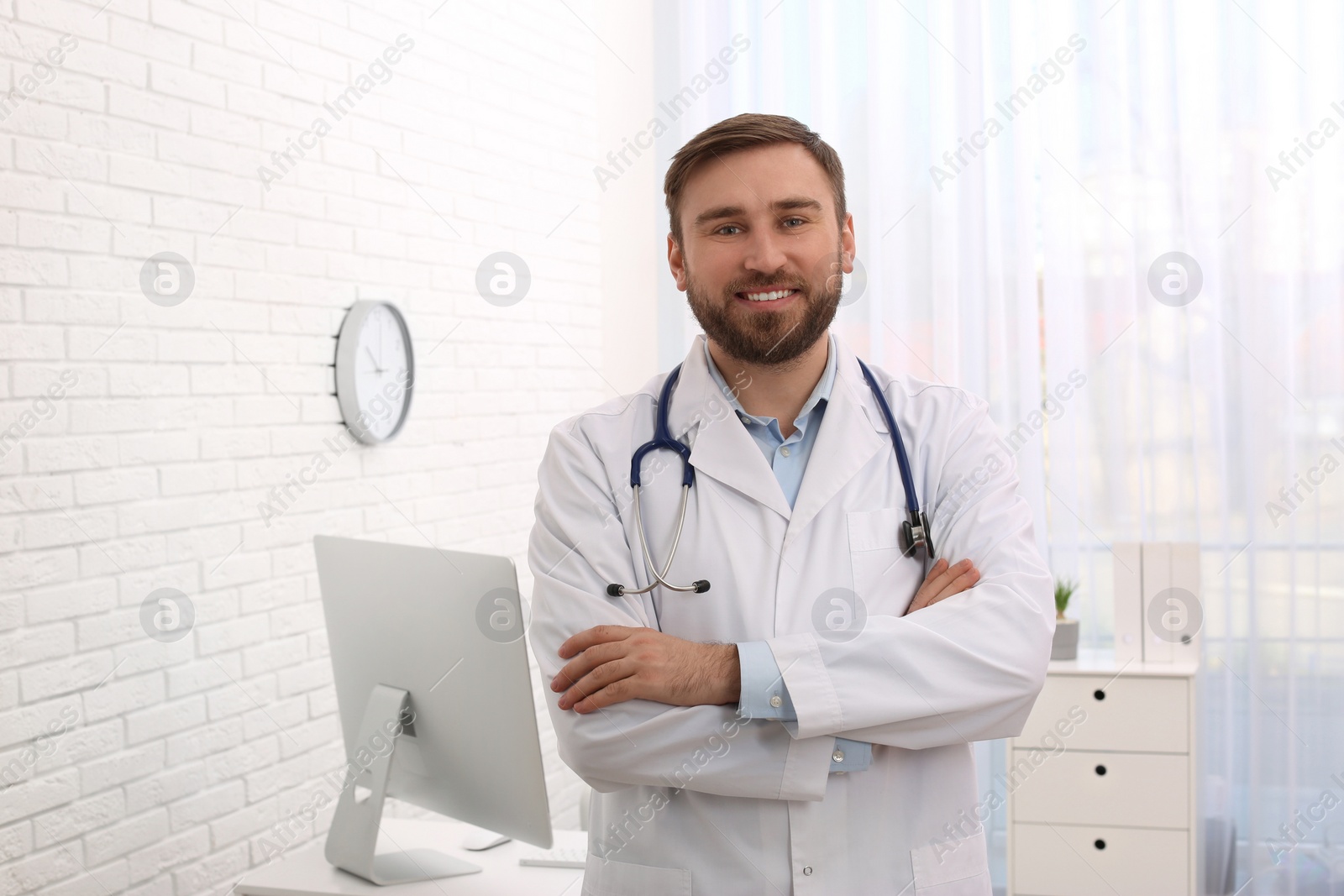 Photo of Portrait of pediatrician with stethoscope in clinic