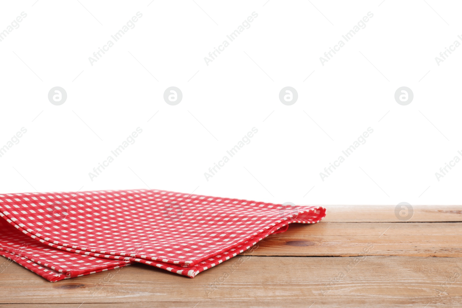 Photo of Red checkered napkins on wooden table against white background. Mockup for design
