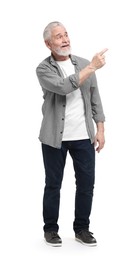 Photo of Senior man pointing at something on white background