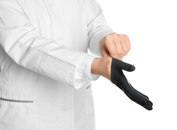 Doctor wearing medical glove on white background