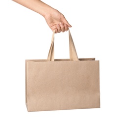 Woman holding paper shopping bag isolated on white, closeup