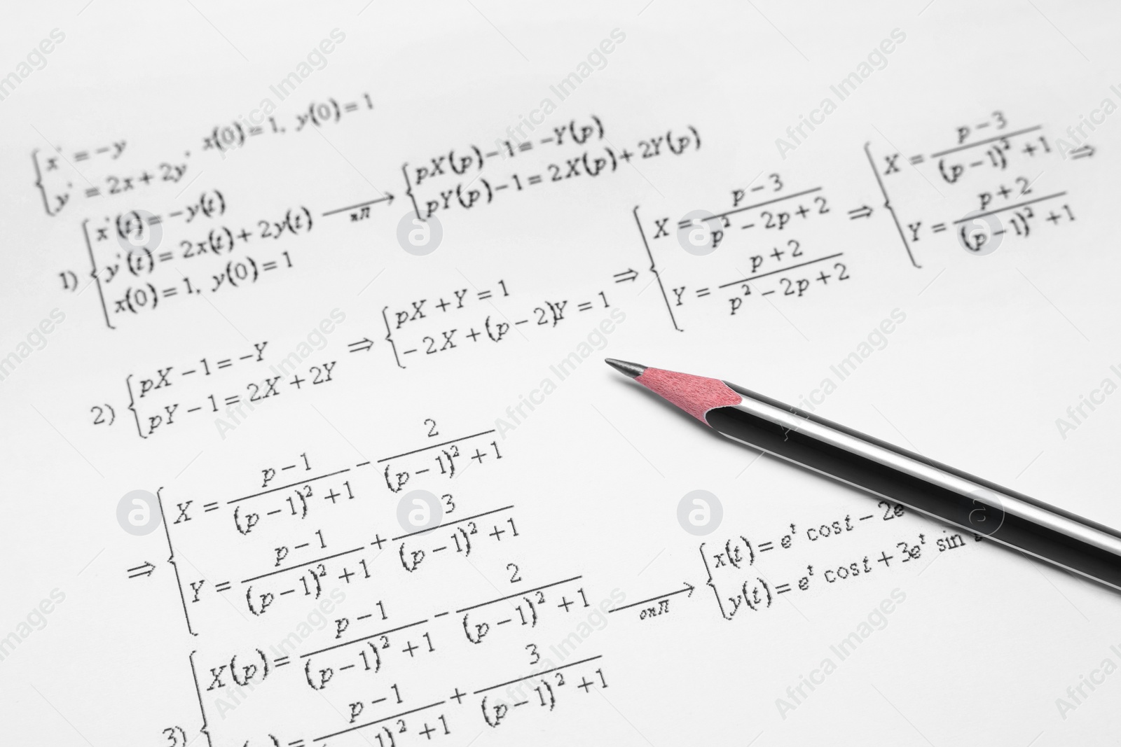 Photo of Sheet of paper with mathematical formulas and pencil, closeup