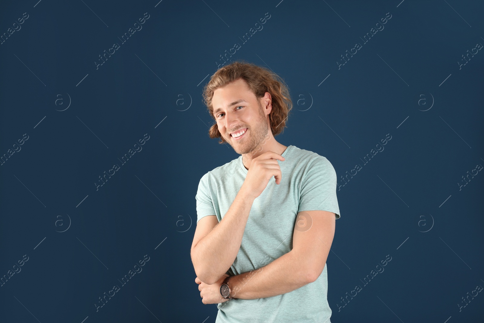 Photo of Portrait of handsome man on color background