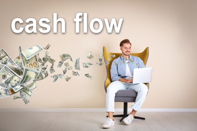 Image of Cash Flow concept. Young man with laptop in armchair near beige wall and flying money
