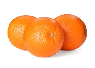 Photo of Tasty whole ripe oranges isolated on white