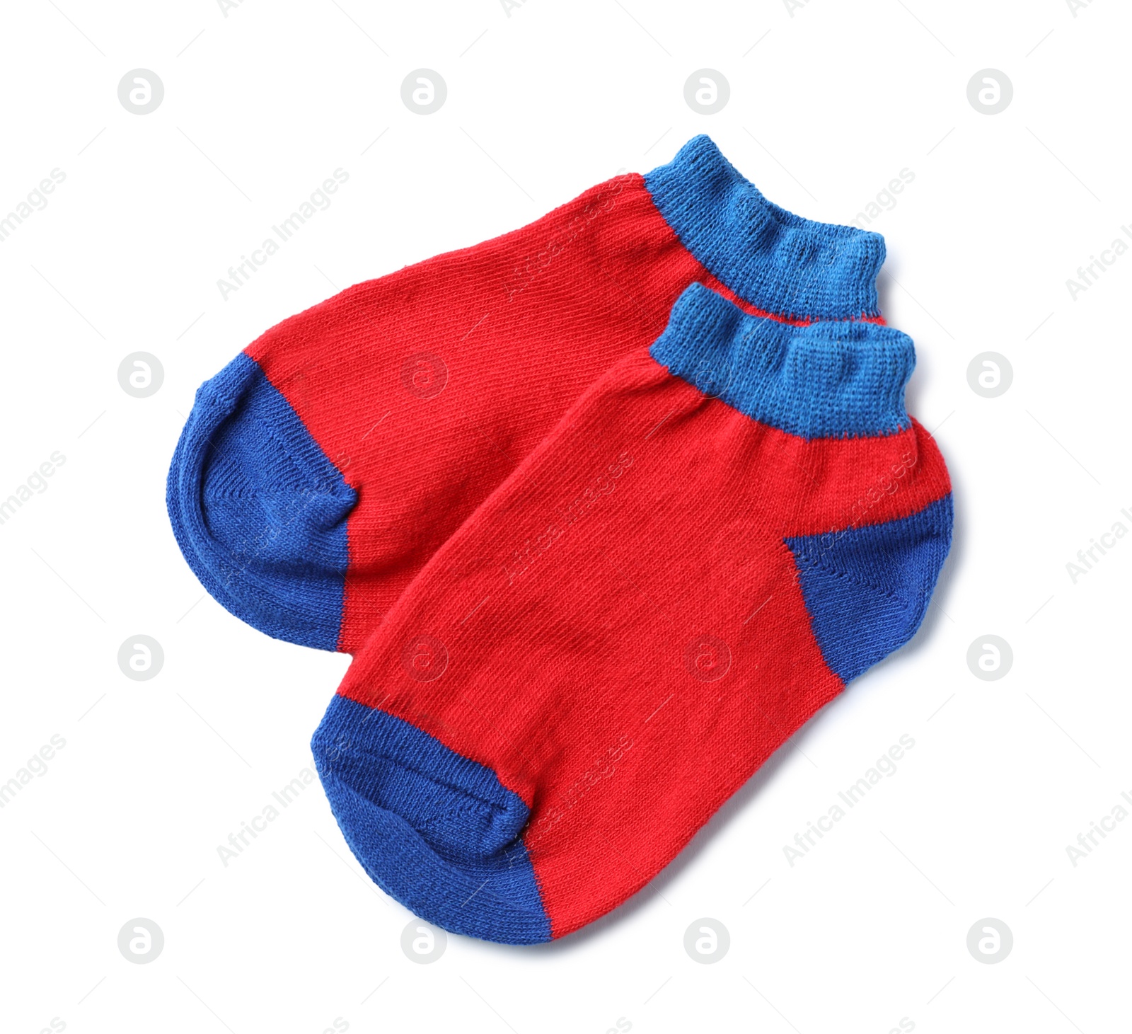 Photo of Cute child socks on white background, top view