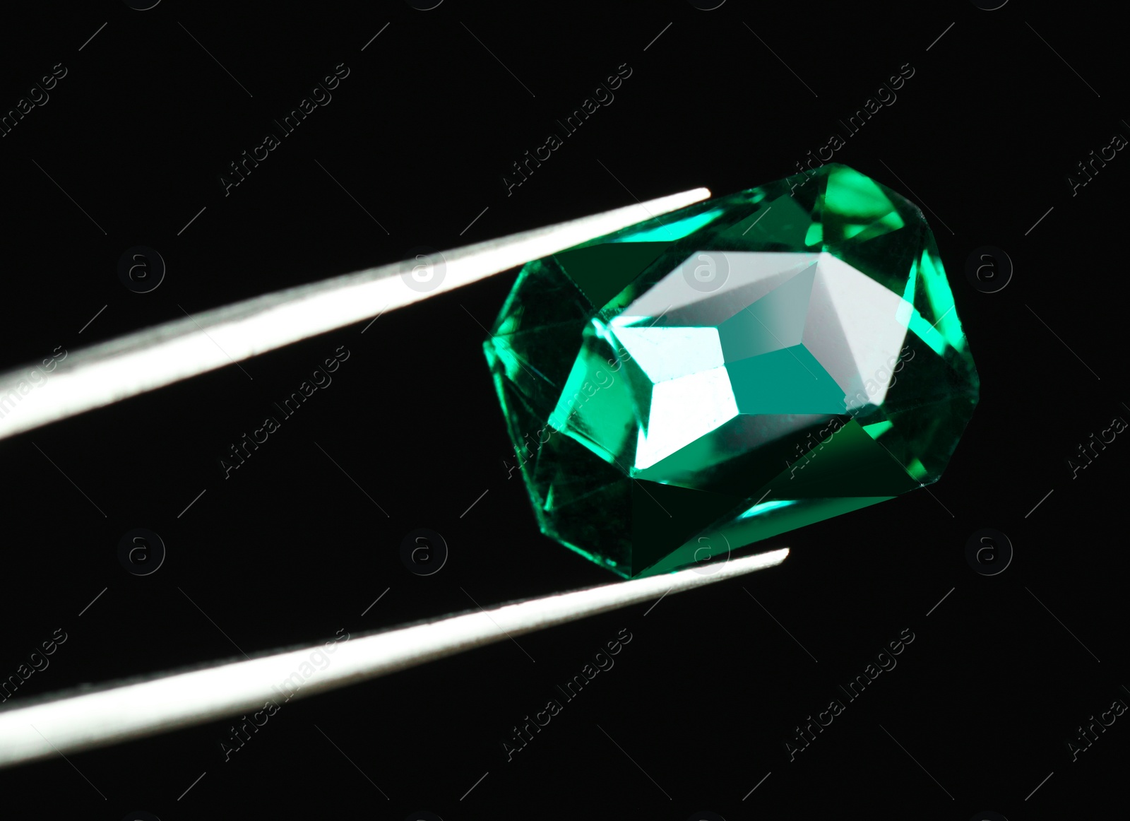 Photo of Tweezers with beautiful gemstone on black background. Space for text