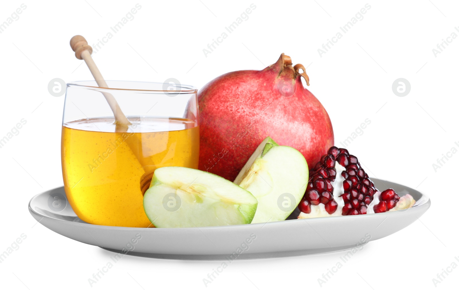 Photo of Honey, apple and pomegranates on white background. Rosh Hashanah holiday