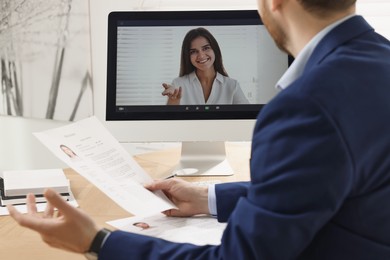 Human resources manager conducting online job interview via video chat on computer, closeup