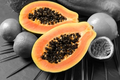 Image of Fresh papaya and other fruits on table. Black and white tone with selective color effect