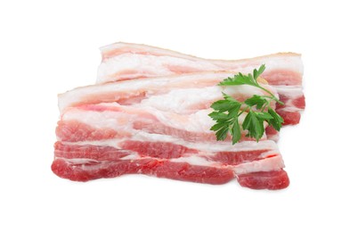 Photo of Pieces of raw pork belly and parsley isolated on white