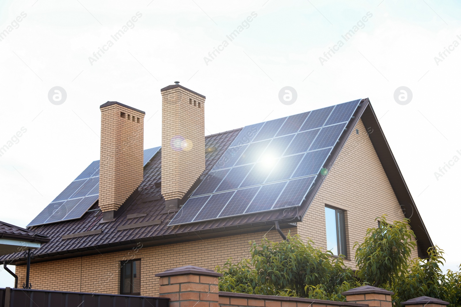 Photo of House with installed solar panels on roof