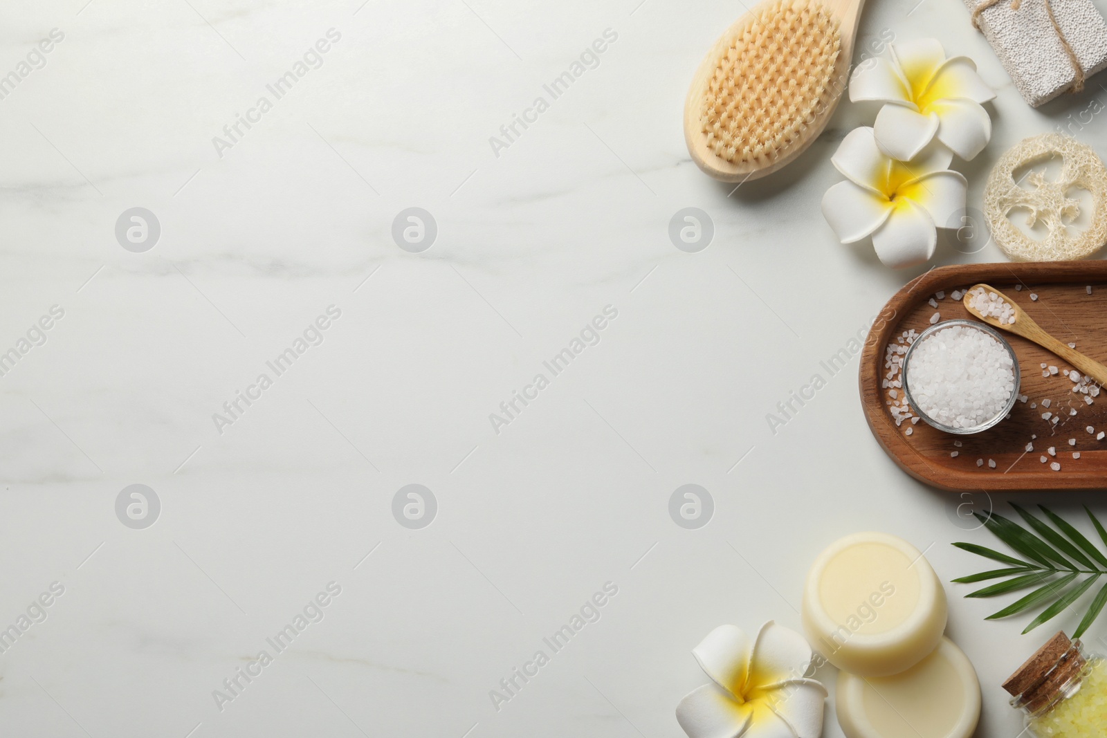 Photo of Flat lay composition with different spa products on white marble table. Space for text