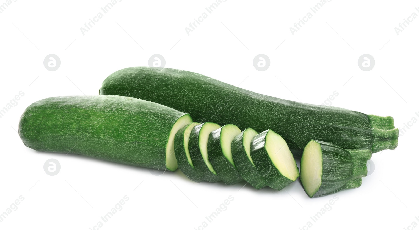 Photo of Fresh ripe green zucchinis isolated on white