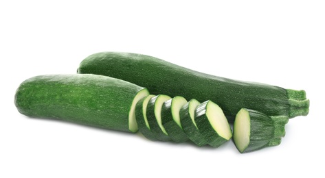 Photo of Fresh ripe green zucchinis isolated on white