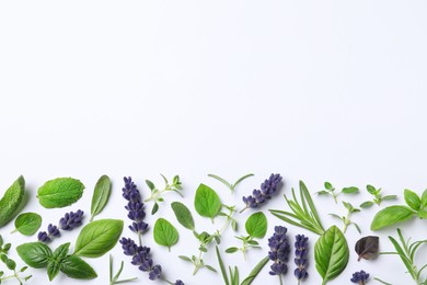 Photo of Many different aromatic herbs on white background, flat lay. Space for text
