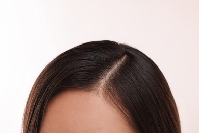 Photo of Woman with healthy hair on white background, closeup