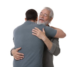 Photo of Happy dad and his son hugging on white background