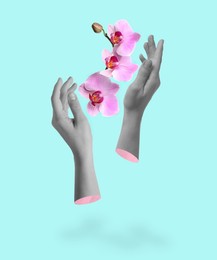 Image of Woman's hands and orchid flowers on light blue background. Creative art design