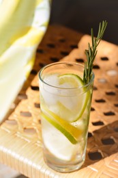 Photo of Summer refreshing lemonade drink on wicker bench