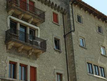 Residential building with balconies and windows in city