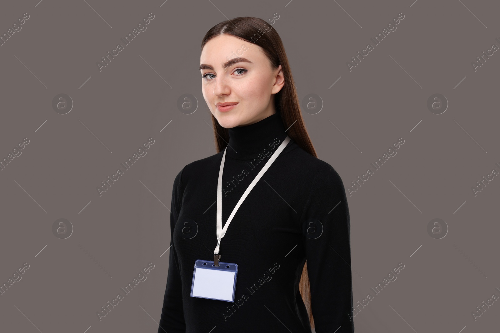 Photo of Woman with blank badge on grey background, closeup