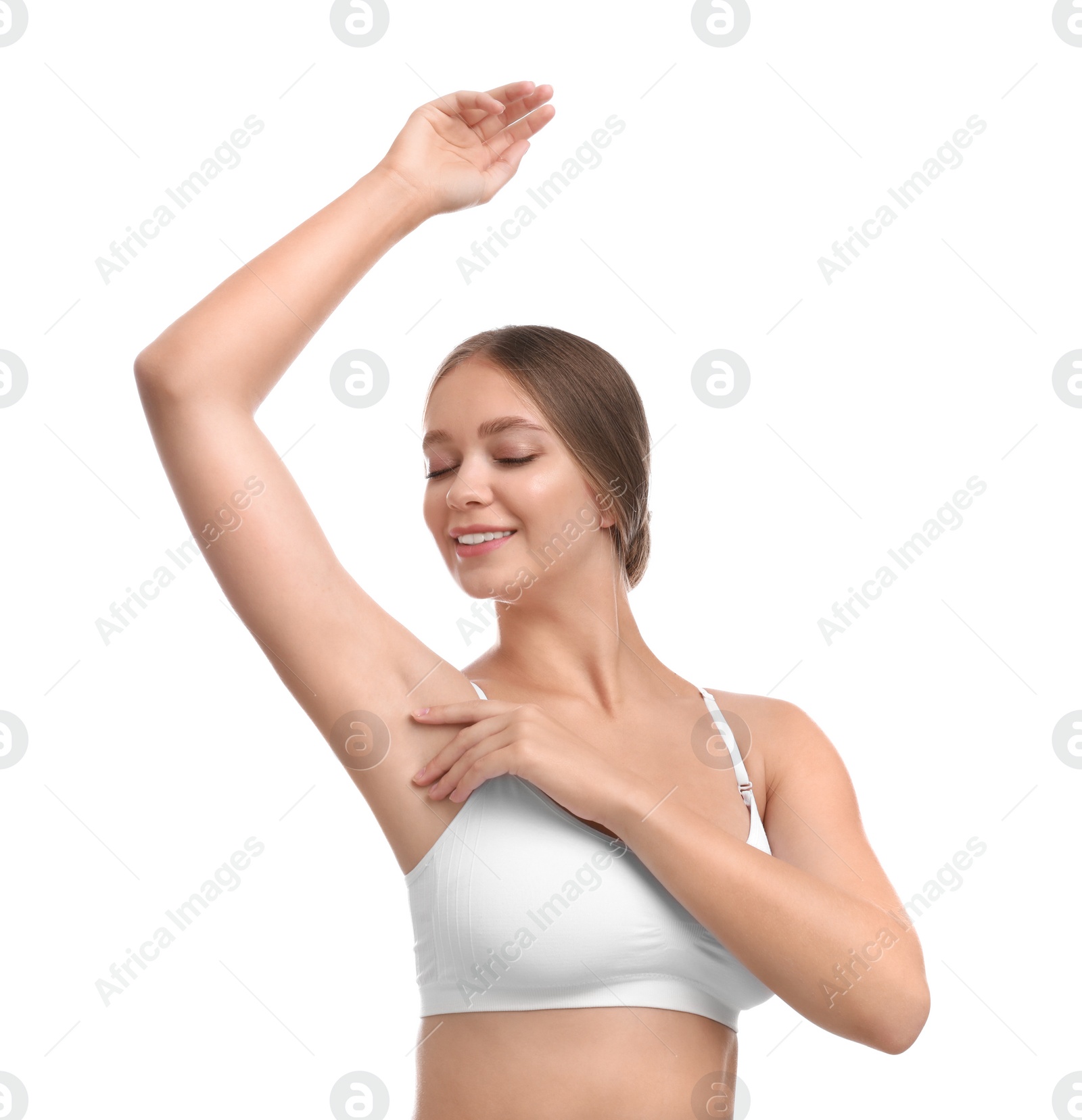 Photo of Young woman with smooth clean armpit on white background. Using deodorant