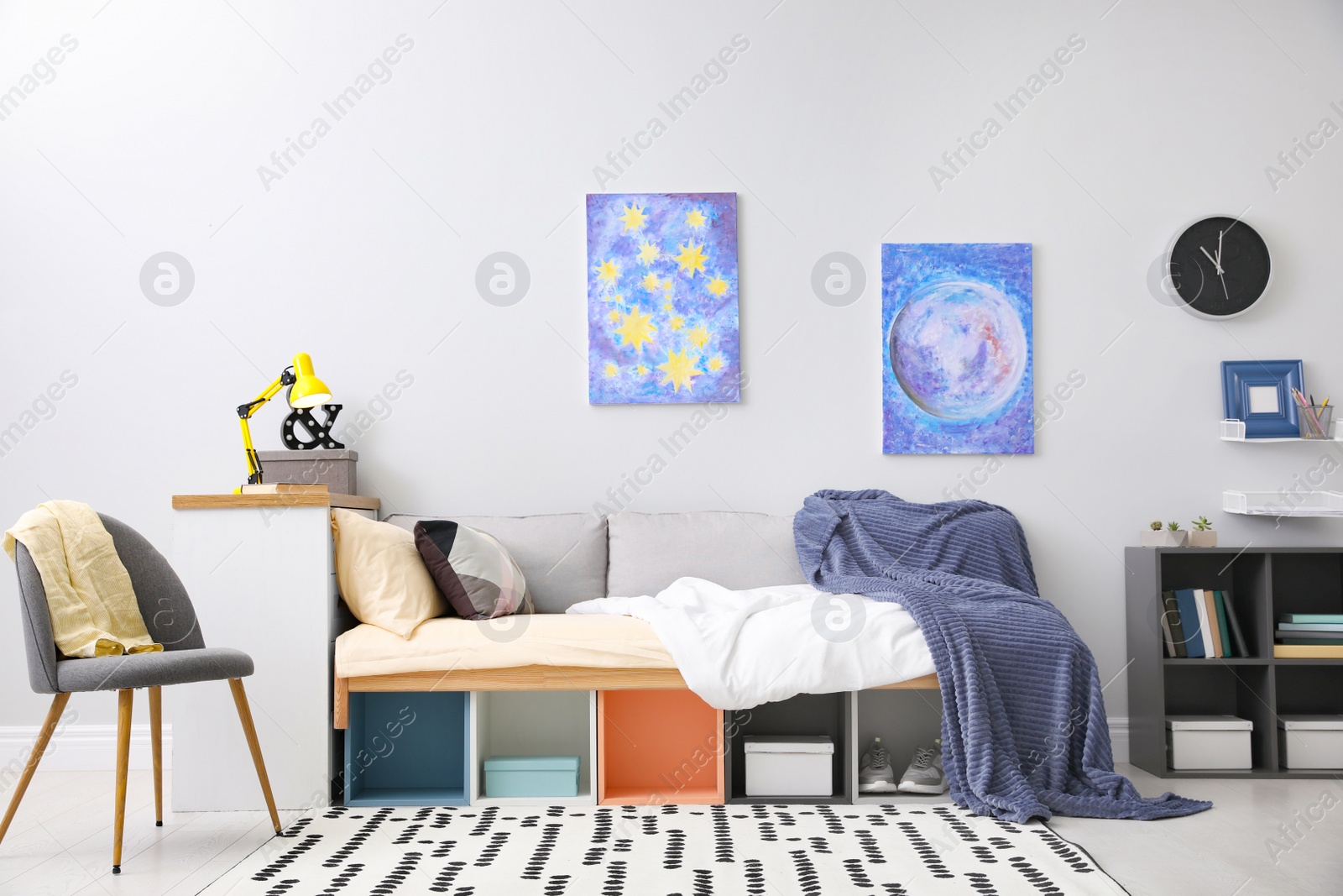 Photo of Modern teenager's room interior with comfortable bed and stylish design elements