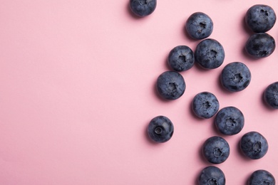 Photo of Flat lay composition with tasty blueberry and space for text on color background