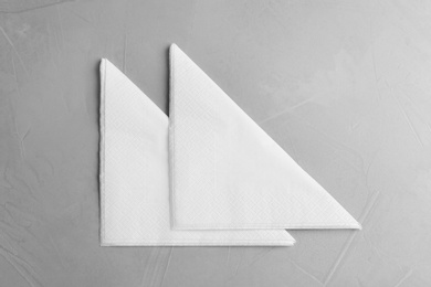 Photo of Clean napkins on light table, top view