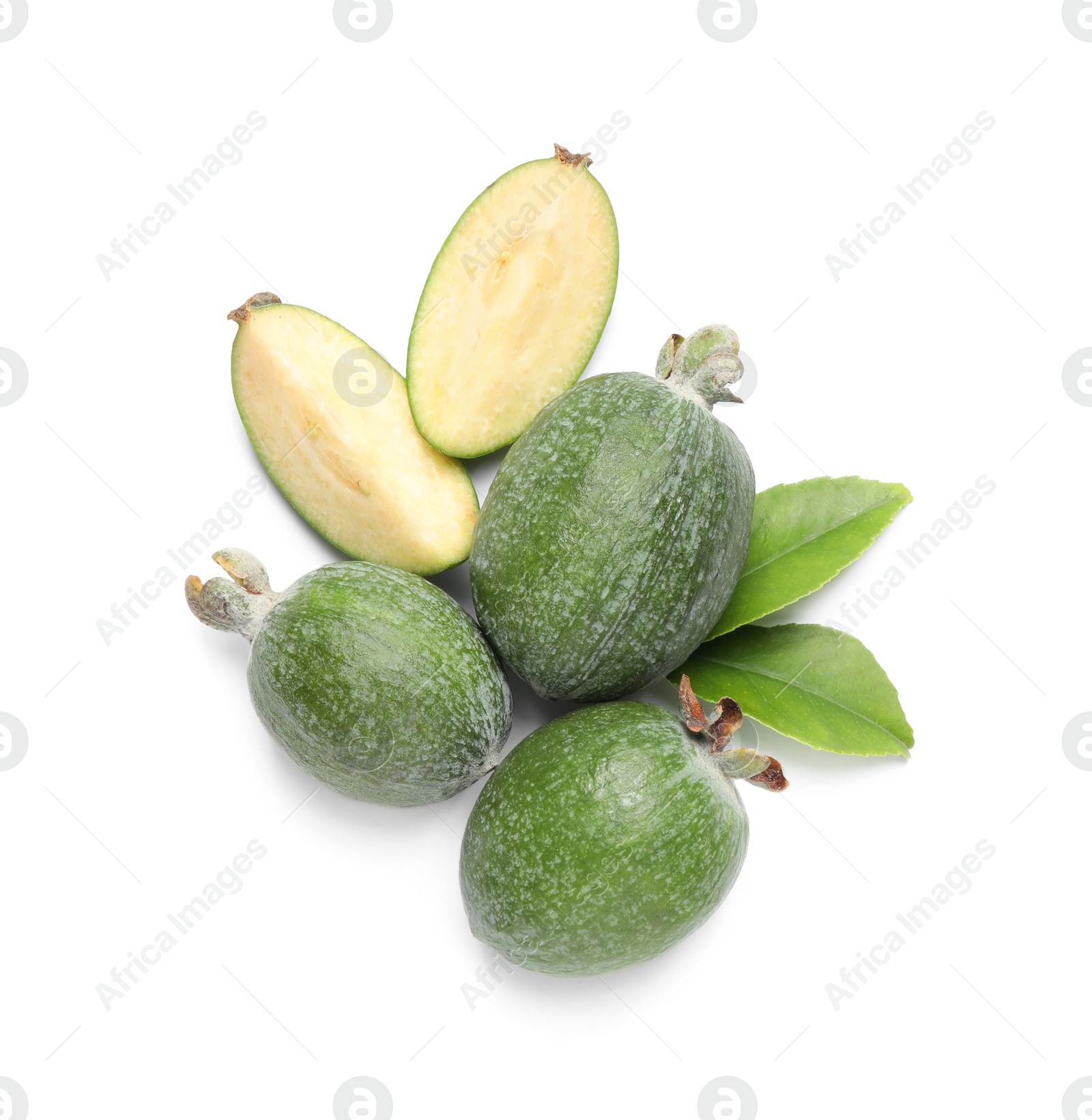 Photo of Cut and whole feijoas with leaves on white background, top view