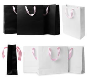 Set with different paper shopping bags on white background