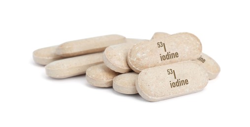 Pile of iodine pills isolated on white