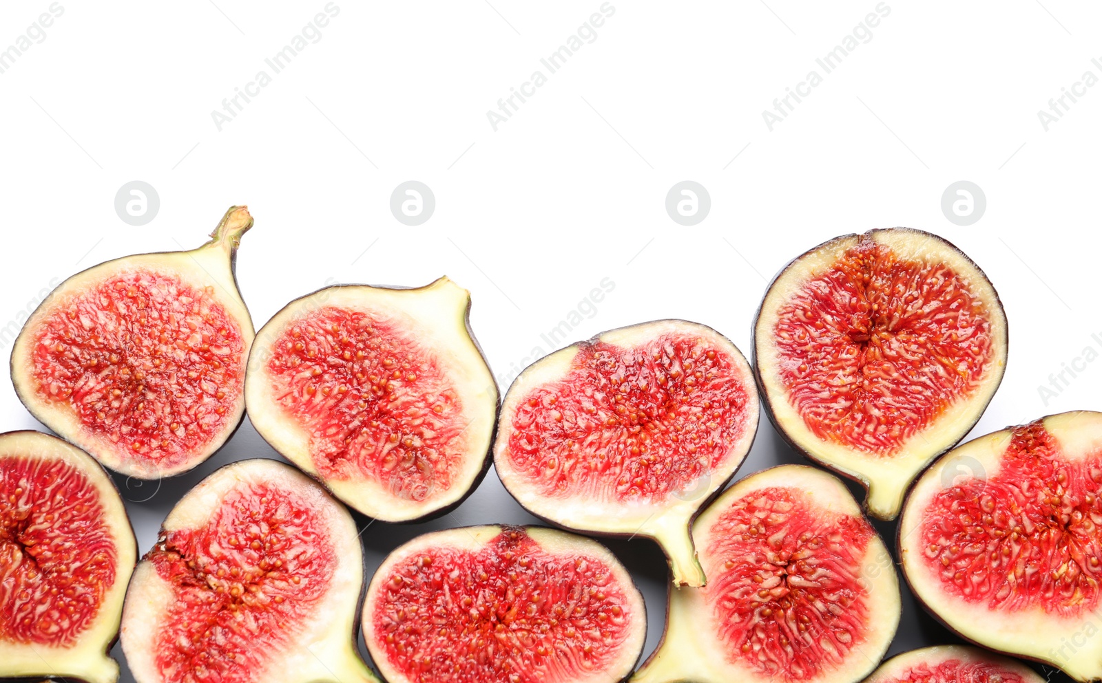 Photo of Cut ripe figs on white background, top view