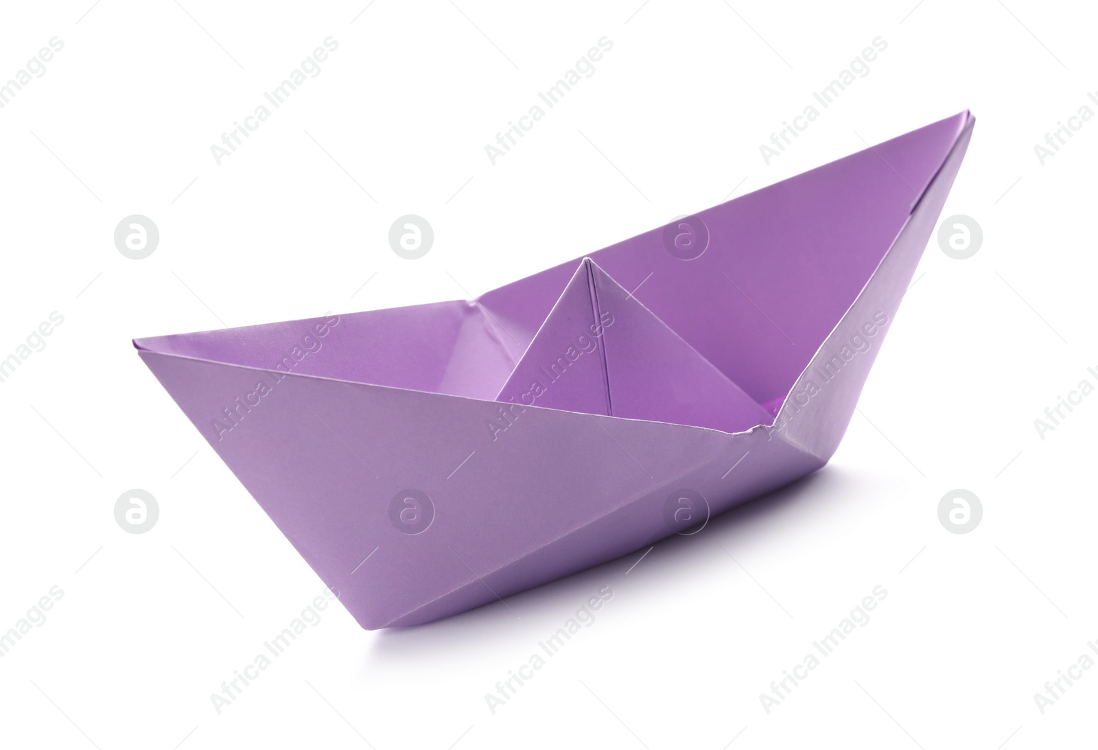 Photo of Handmade violet paper boat isolated on white. Origami art
