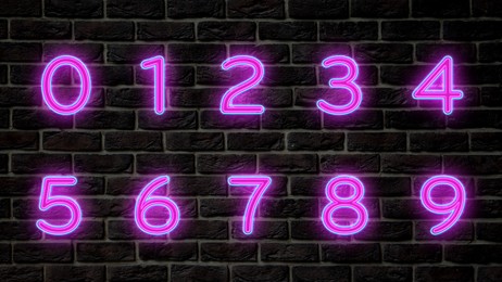 Image of Glowing neon number signs on brick wall