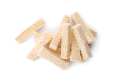 Photo of Heap of crispy rusks on white background, top view