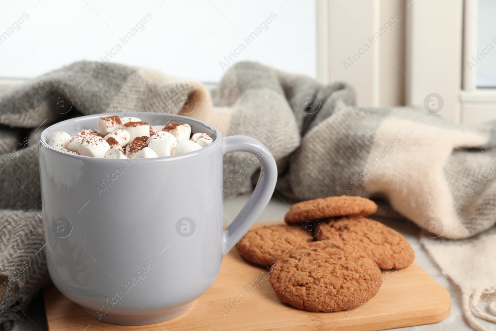 Photo of Composition with cup of cocoa and cookies on windowsill. Winter drink