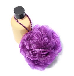 New purple shower puff and bottle of cosmetic product on white background