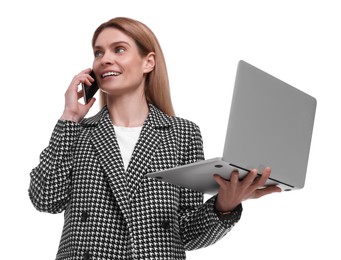 Beautiful happy businesswoman with laptop talking on smartphone against white background