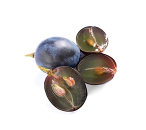 Photo of Cut and whole fresh ripe juicy grapes with seeds on white background