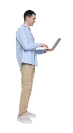 Young man using laptop on white background