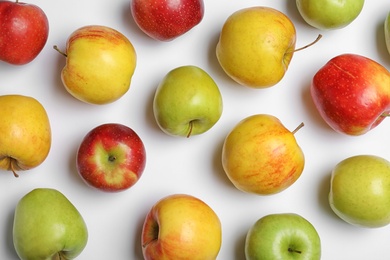 Photo of Fresh tasty apples on white background, flat lay