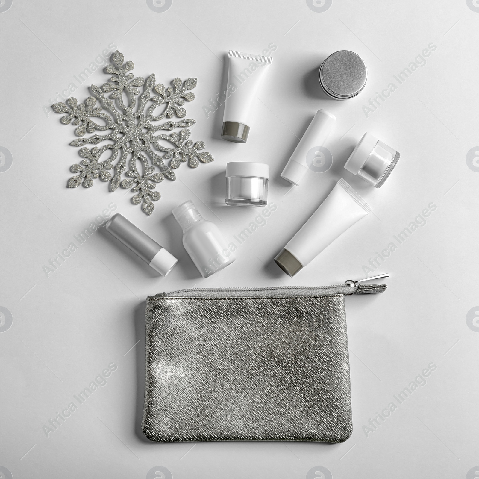 Photo of Set of cosmetic products on white background, flat lay. Winter care