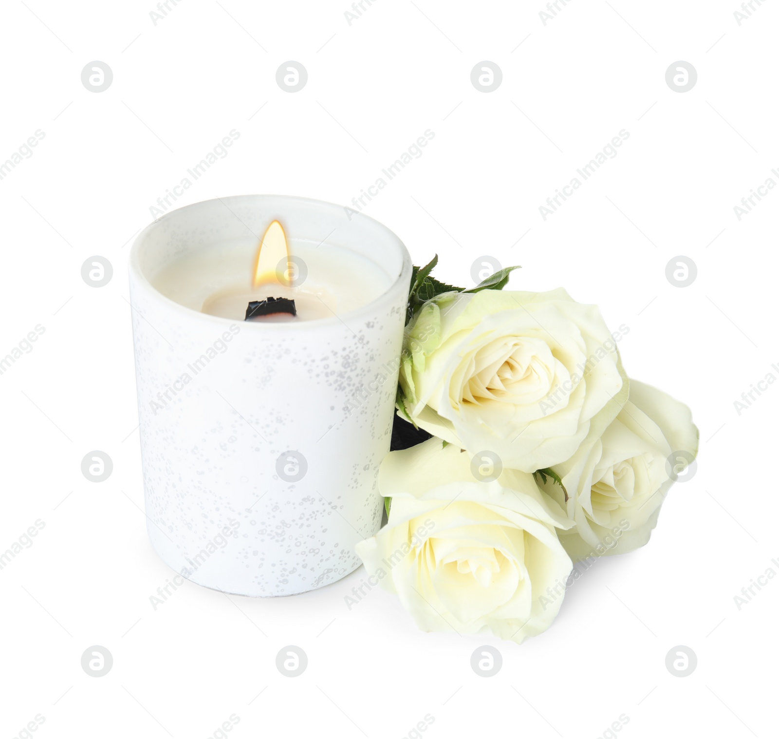 Photo of Aromatic candle with wooden wick and beautiful flowers on white background