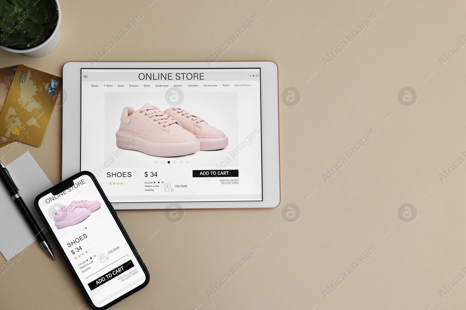 Photo of Online shopping. Flat lay composition with modern tablet and smartphone on beige background