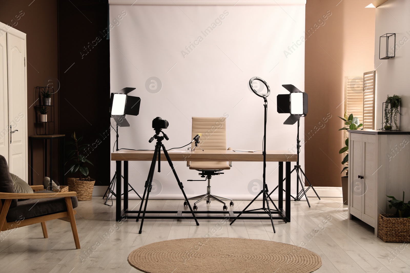 Photo of Modern blogger's workplace with professional equipment in room