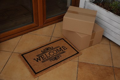 Photo of Parcels delivered on mat near front door
